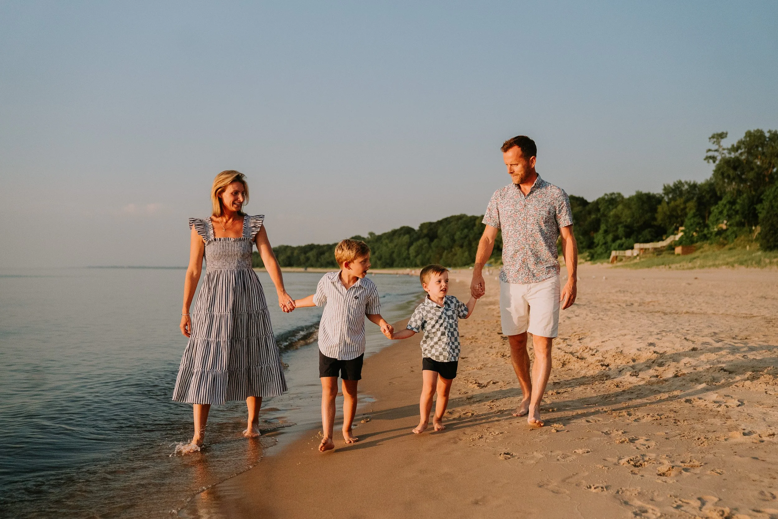 Family walking along beach at Union Pier