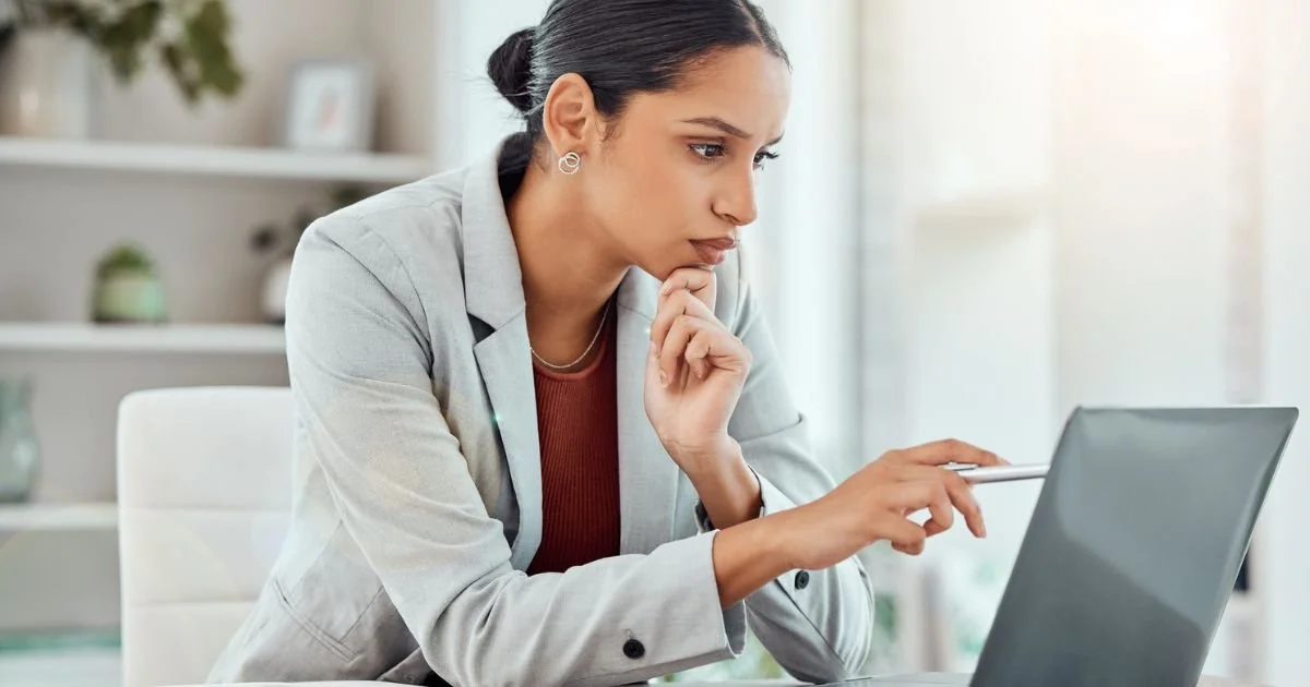 Professional reviewing 401(k) retirement account on laptop