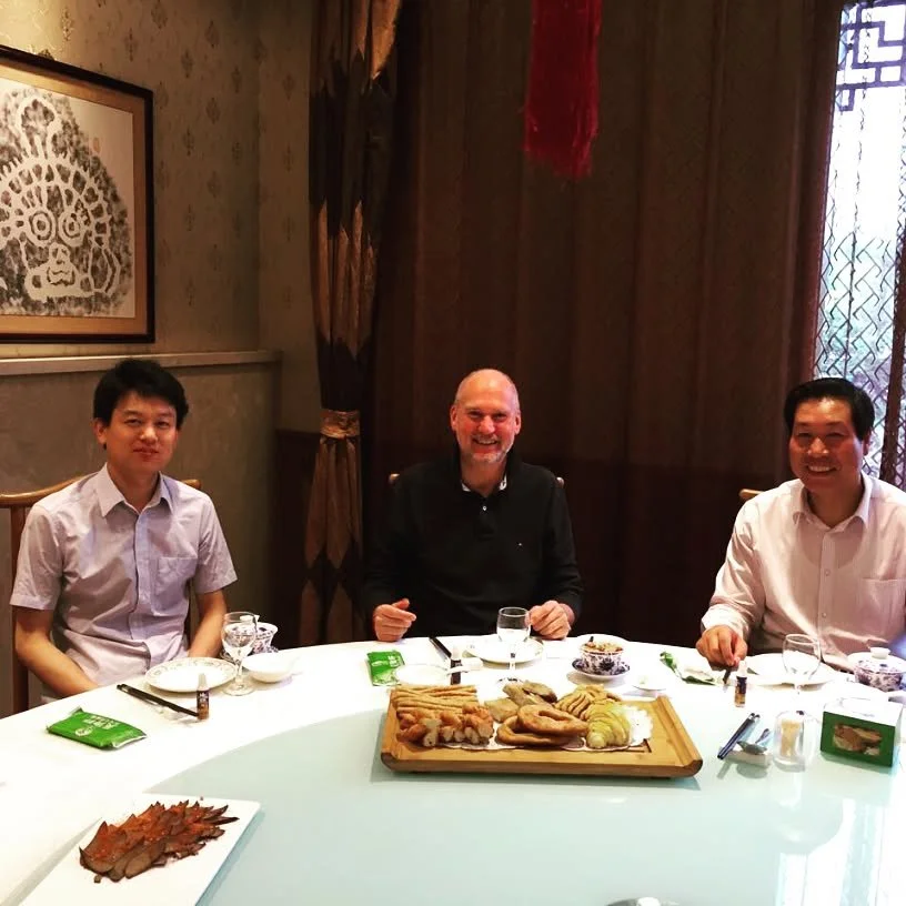 Lenz, Dr Jin Gang, and Mr Fan celebrate Dragon Boat Festival.