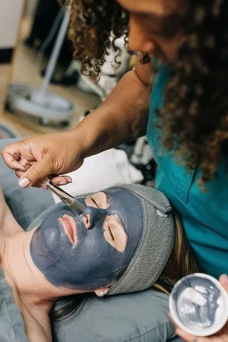 woman enjoying mud mask