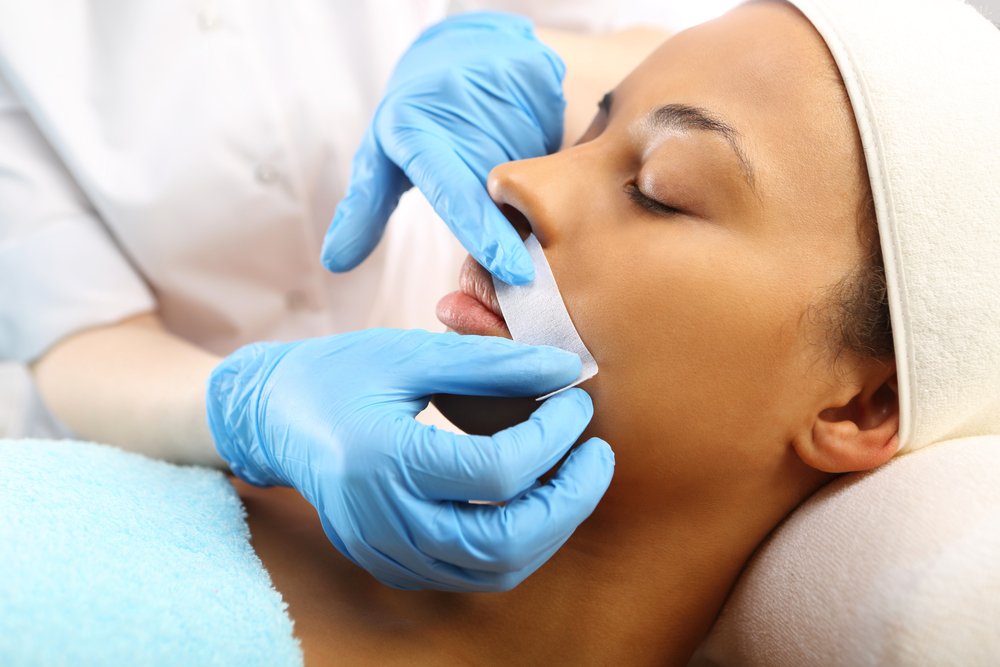 Waxing female upper lip
