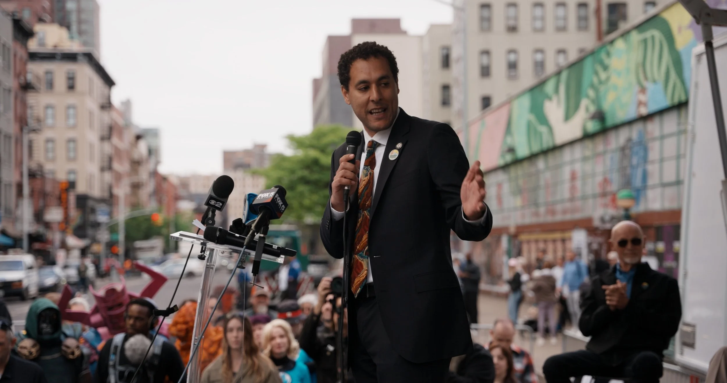 Council Member Marte speaks before the unveiling
