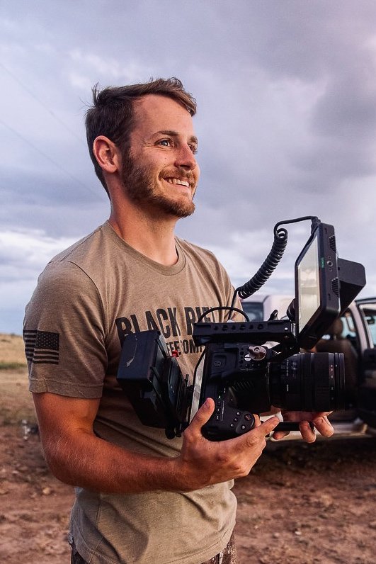 Gaines Roberts, founder of Bravo Film House, holding a cinema camera in Greenville, SC