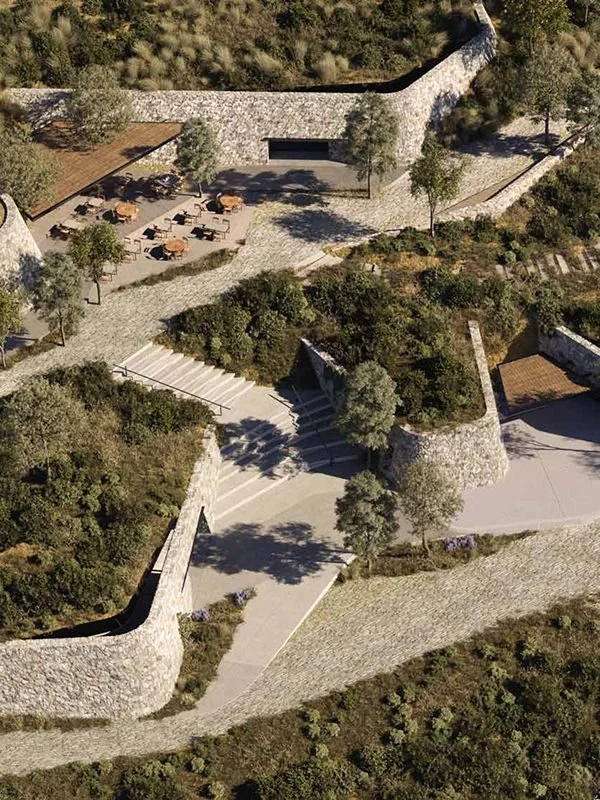 Aerial rendering of a terraced stone landscape with pathways, gathering terraces, and native plantings woven into the hillside, illustrating landscape architecture and site design.