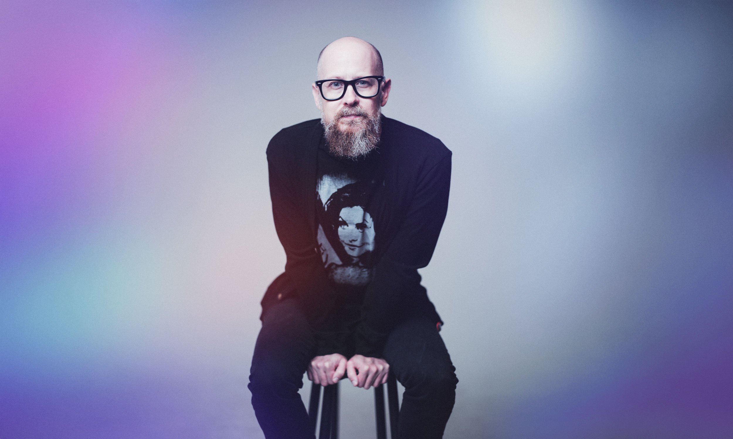 Personal branding portrait on a colored studio backdrop — Draper Studios Denver