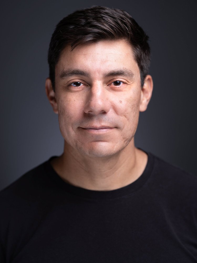 Approachable professional headshot in a black shirt, Denver headshot photographer