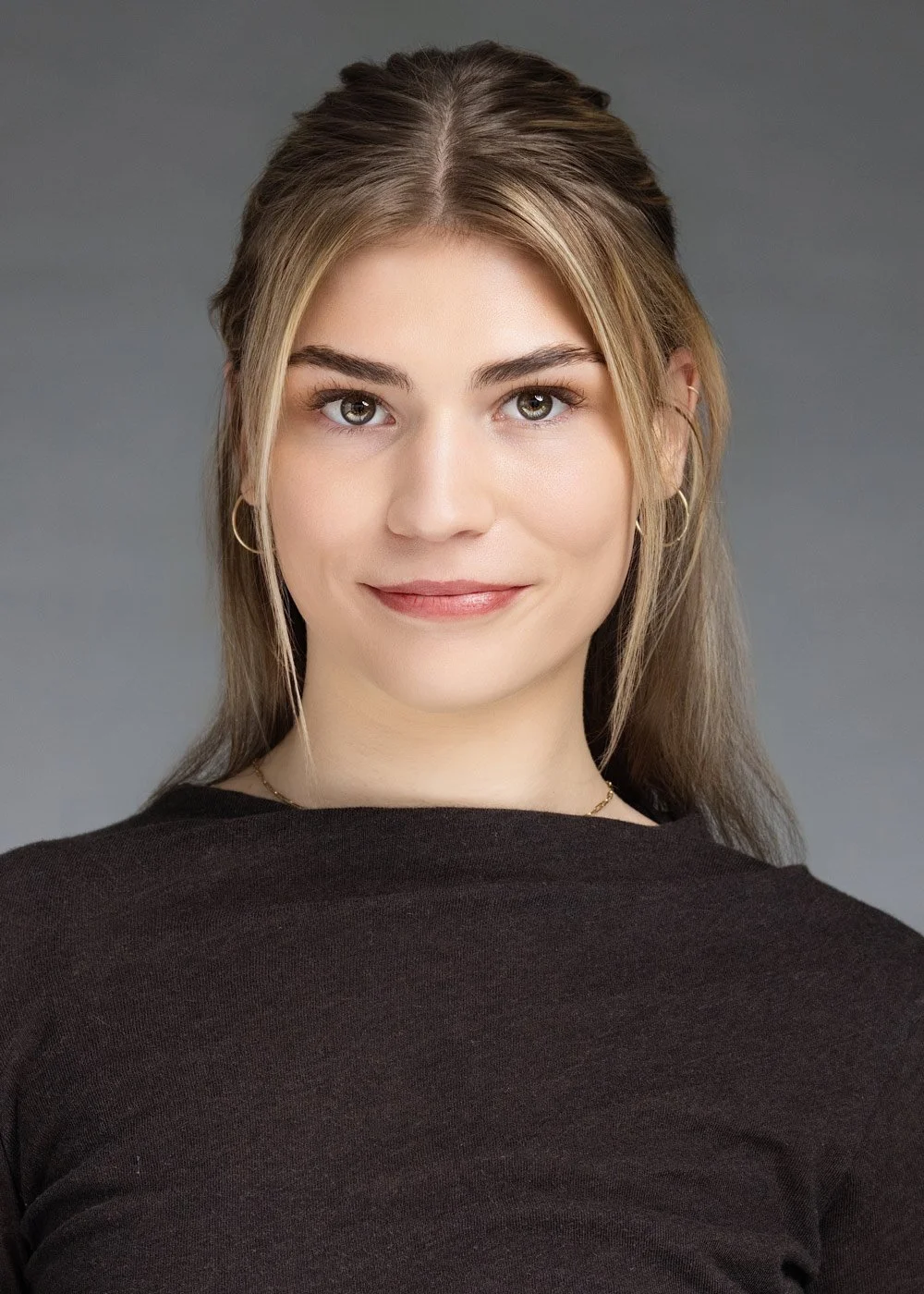 Professional headshot of a woman with glasses, Denver business headshots