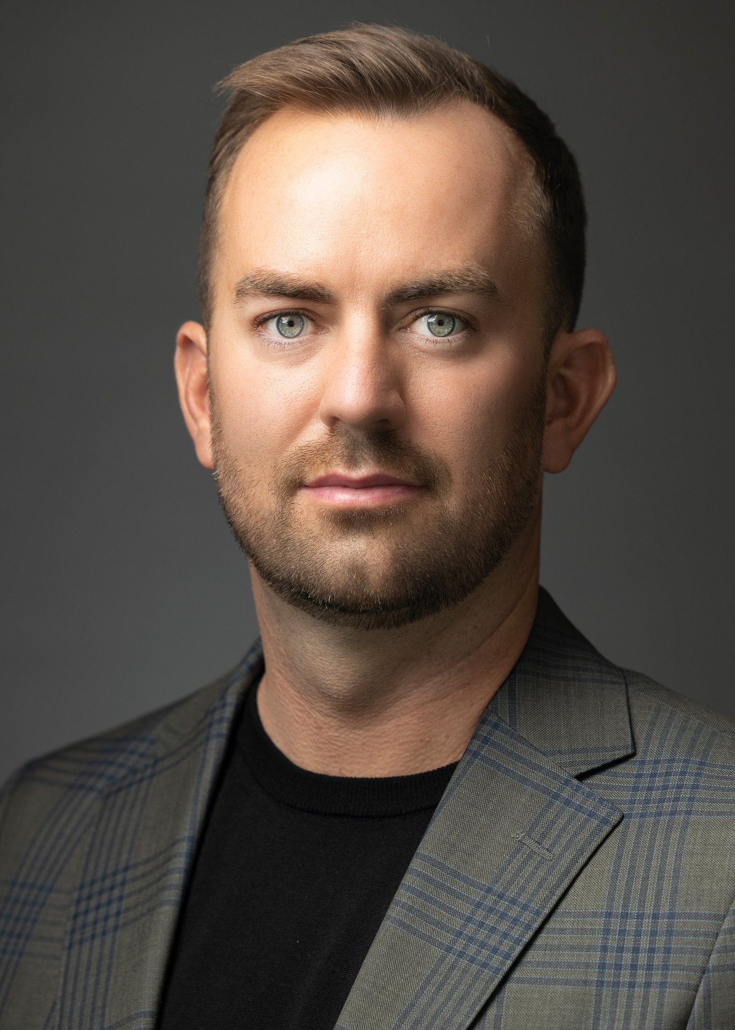 Professional male business headshot photographed by Draper Studios in Denver