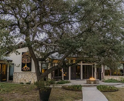 odging exterior at Asante in Dripping Springs Texas Hill Country with garden and walkway