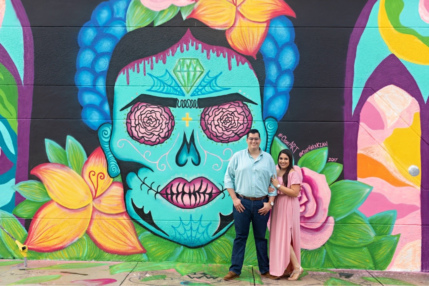 01_Wynwood-Walls-Engagement-Session-Miami-Engagement-Photographer_6411 1_posing_during_couple_in_walls_engagement_wynwood_hispanic_a_session_Mural_thier_of_front_Miami_photographer.jpg