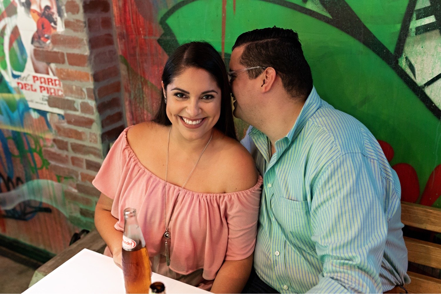 09_Wynwood-Walls-Engagement-Session-Miami-Engagement-Photographer_6713 1_during_couple_stand_eating_walls_wynwood_engagement_hispanic_session_at_taco_thier_the_Miami_photographer.jpg