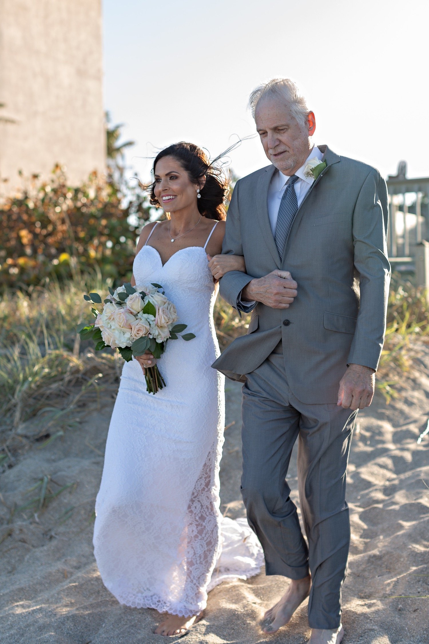 15_Jensen-Beach-Wedding-Jensen-Beach-Wedding-Photographer_0682_father_her_bride_during_Jensen_alter_beach_the_with_to_walking_wedding.jpg