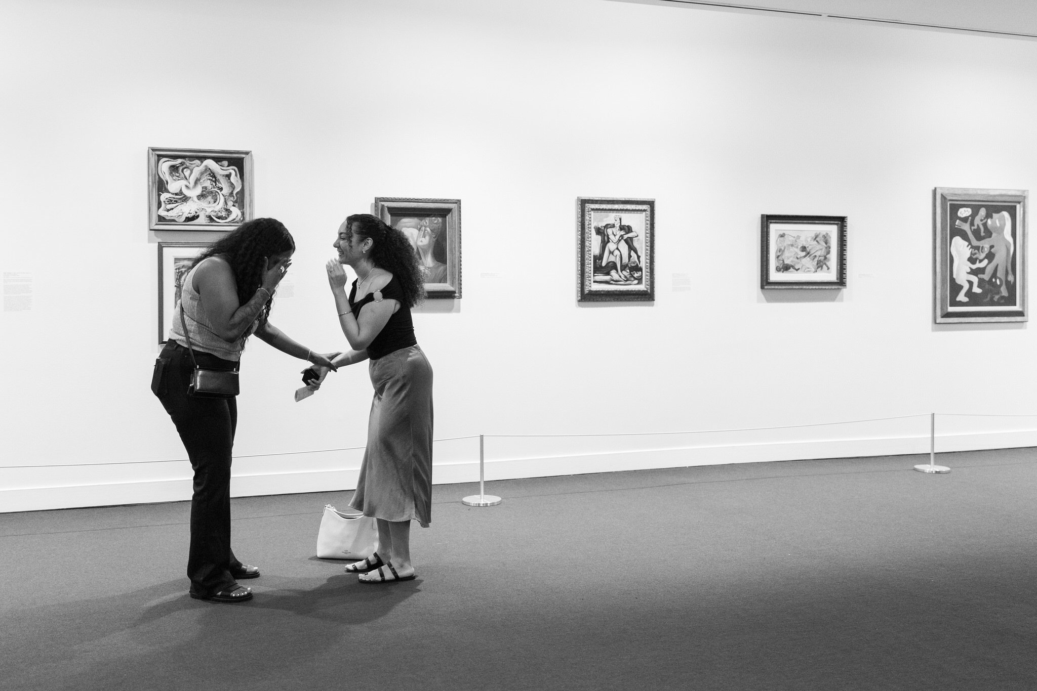 Emotional reaction during surprise proposal at NSU Art Museum in Fort Lauderdale