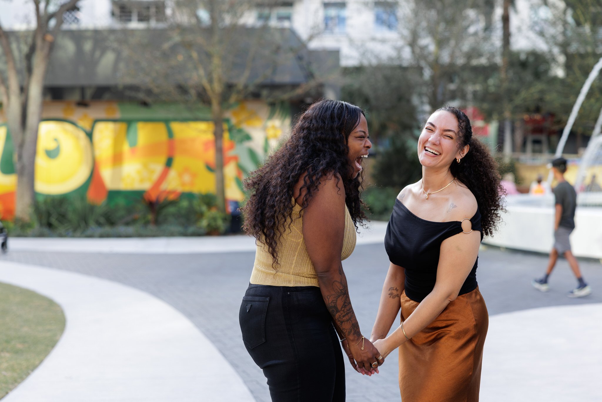 Couple posing near Love mural in downtown Fort Lauderdale after proposa