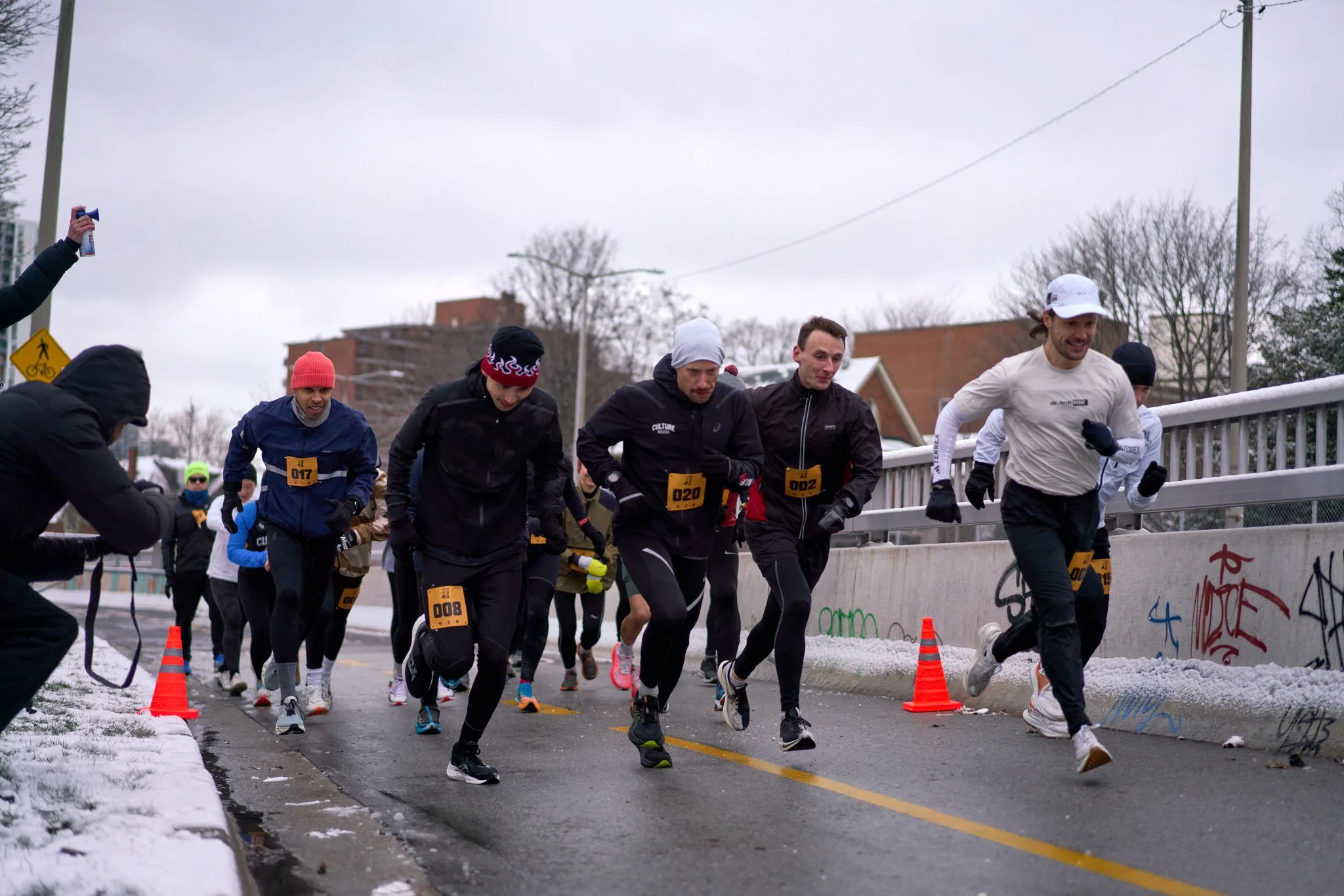Runners start a marathon in Hamilton, Ontario. Each of them has properly tapered to be able to run a personal best and avoid running injuries.