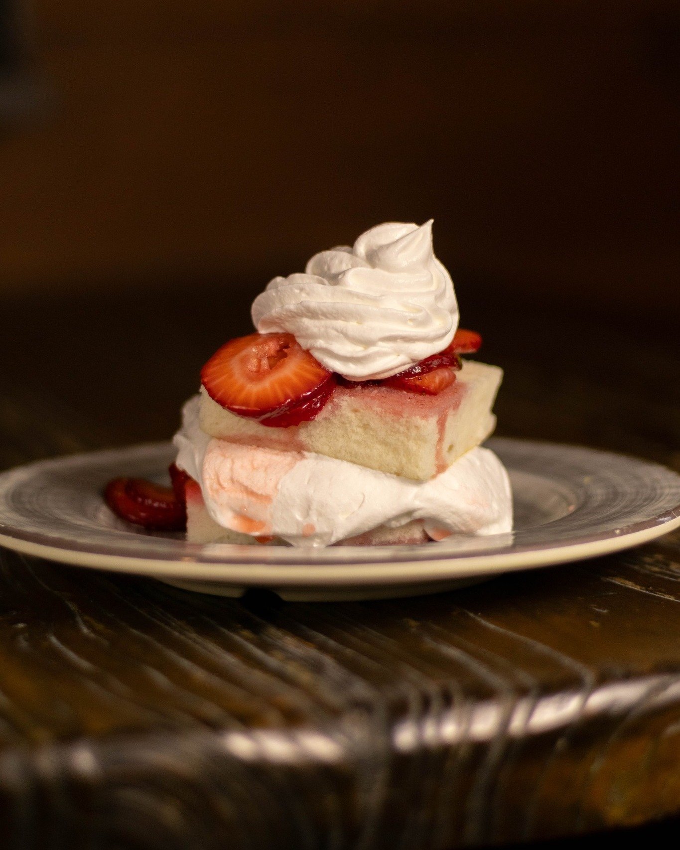 Save room for this stack of sweetness 🍓 Our new dessert is a fluffy white cake soaked in strawberry jello, served with whipped cream &amp; strawberries.