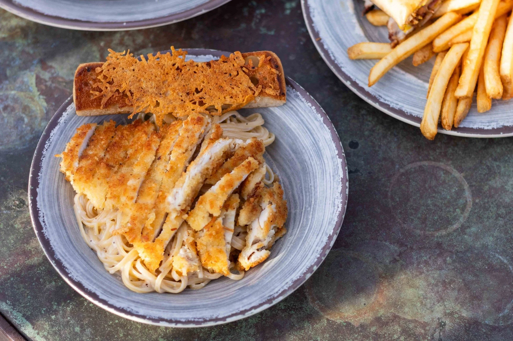 Try our chicken parmesan in lemon cream sauce with linguine &amp; parmesan-crusted bread on the side for $15.99 on Wednesdays for the month of December! 🍝