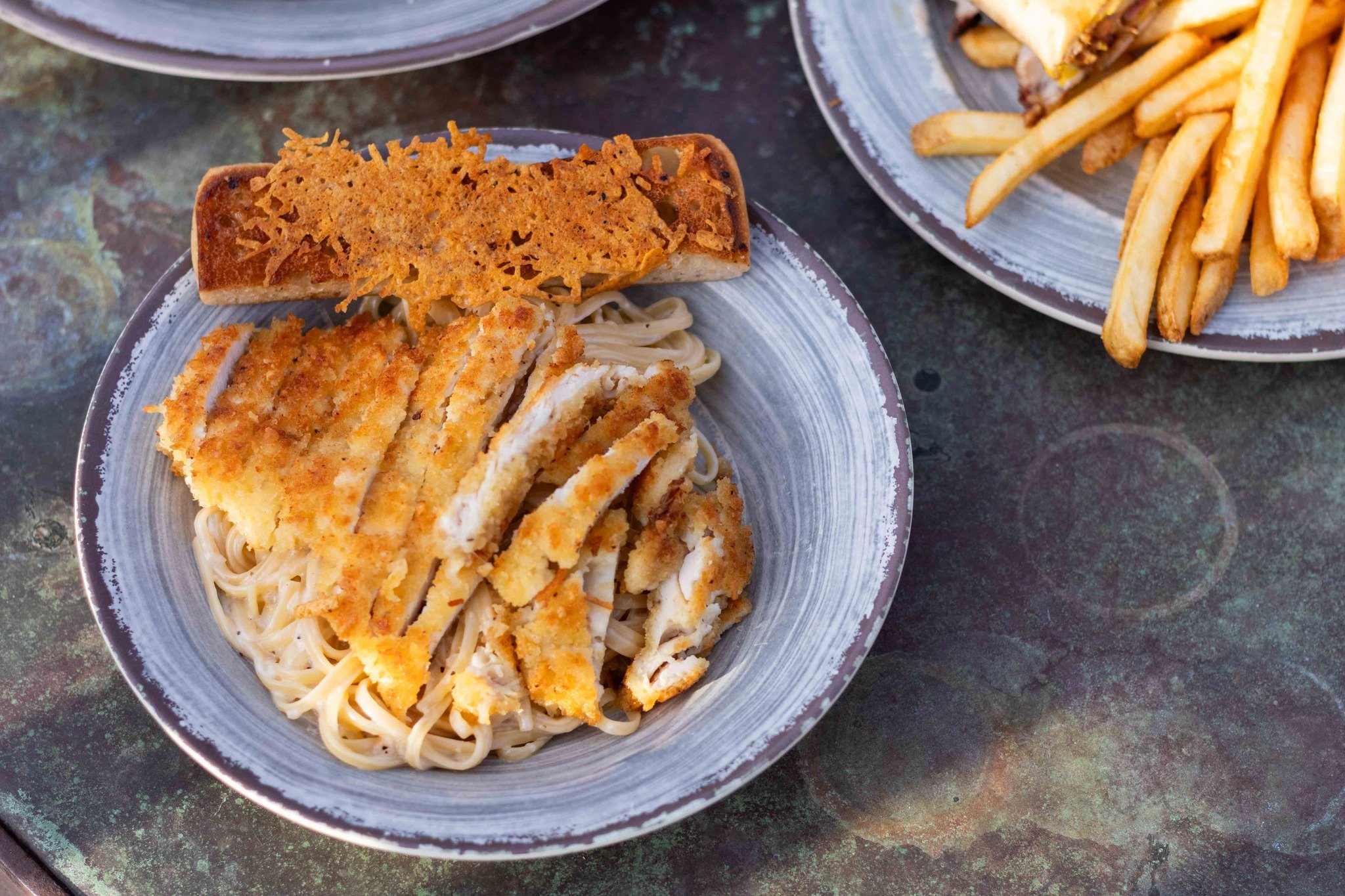 Try our chicken parmesan in lemon cream sauce with linguine &amp; parmesan-crusted bread on the side for $15.99 on Wednesdays for the month of December! 🍝