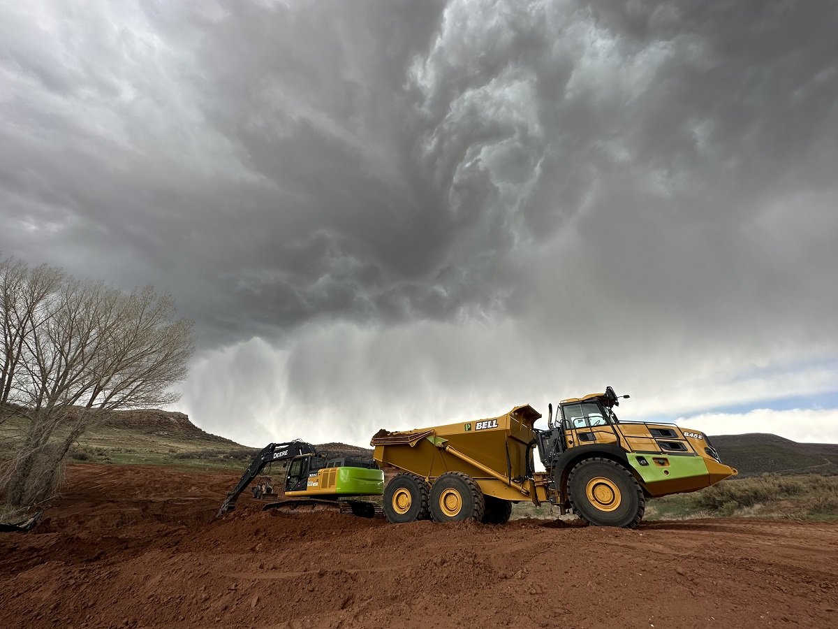 How do you remove a 300 foot long earthen dam?