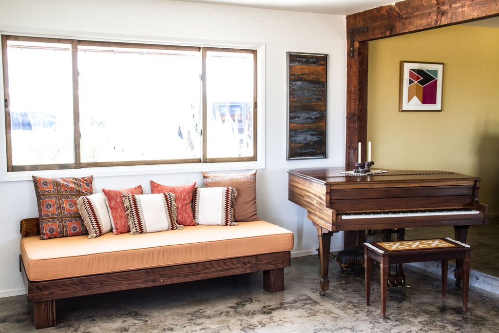 Baby Grand piano and platform couch in the GT Ranch