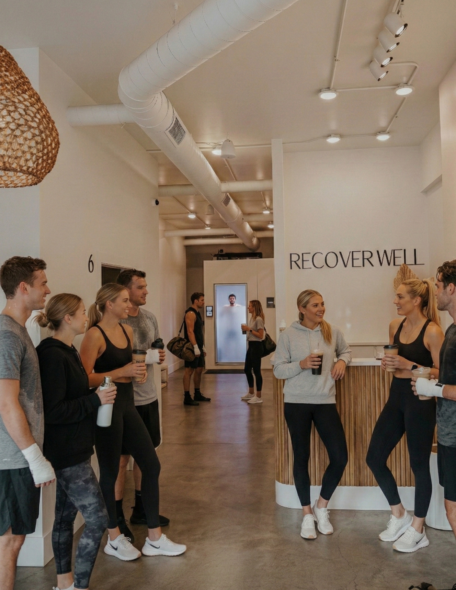 Friends hanging out and socializing post workout at Recover Well