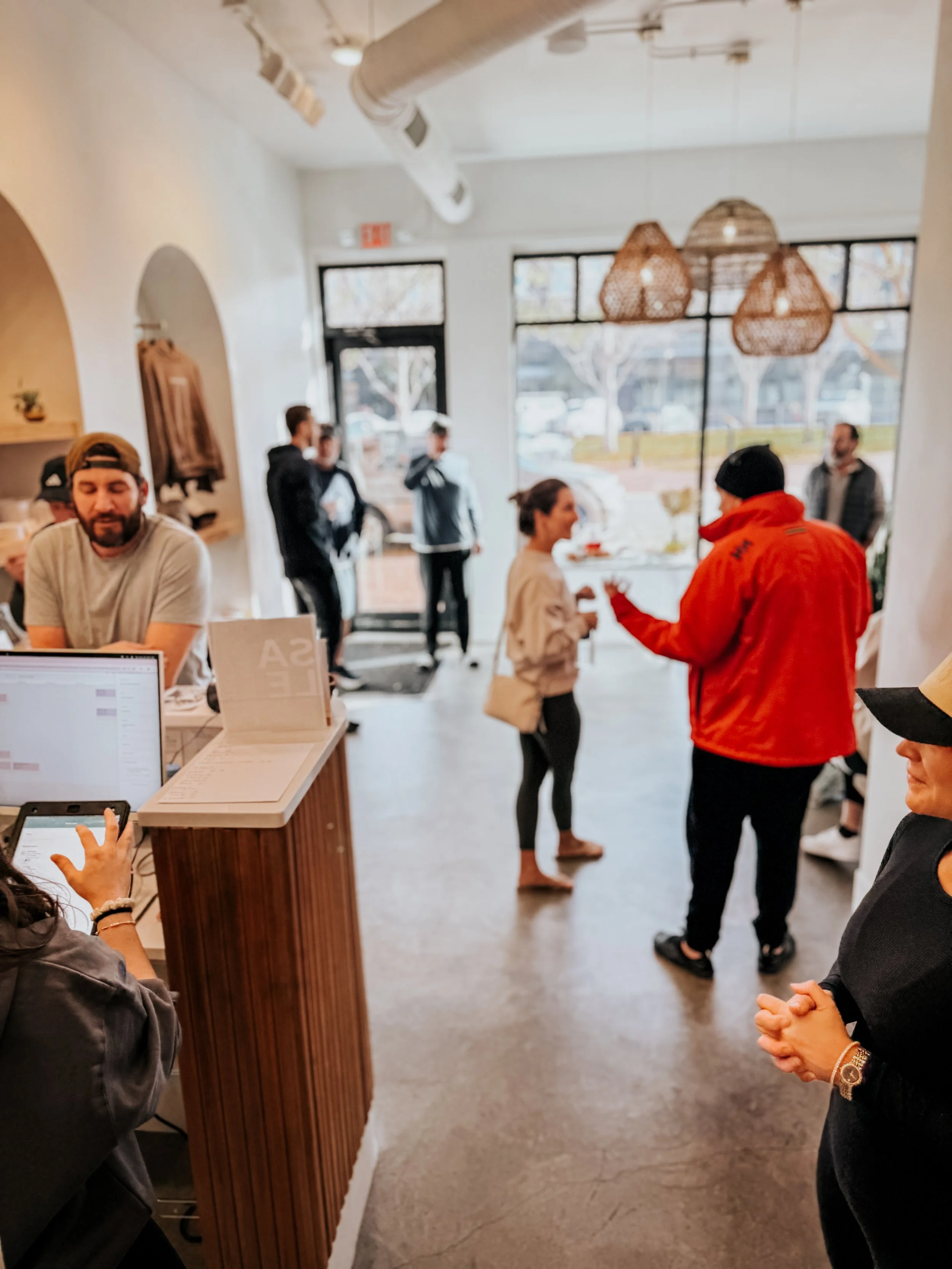 Friends hanging out and socializing post workout at Recover Well
