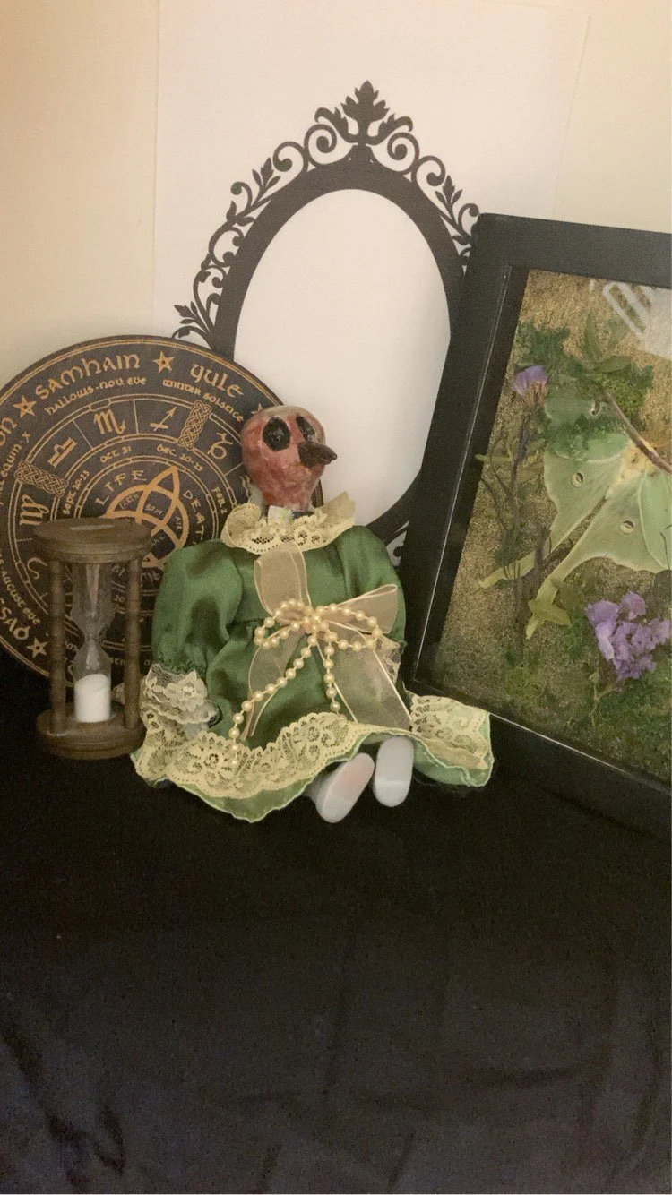 Eloise - In the quaint town of Hollow Gourd lived a little girl named Eloise Kaye. Eloise was always seen in her favorite green dress and was captivated by marble-colored birds. She loved them so much that, in her afterlife, she was transformed into 