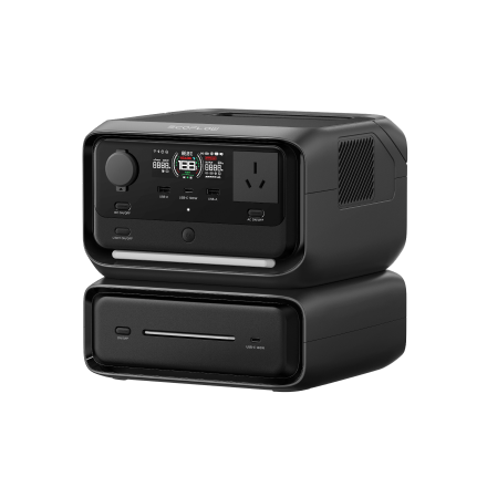 Black electronic device with digital display, control knobs, and a power outlet, placed on top of a drawer-like base.