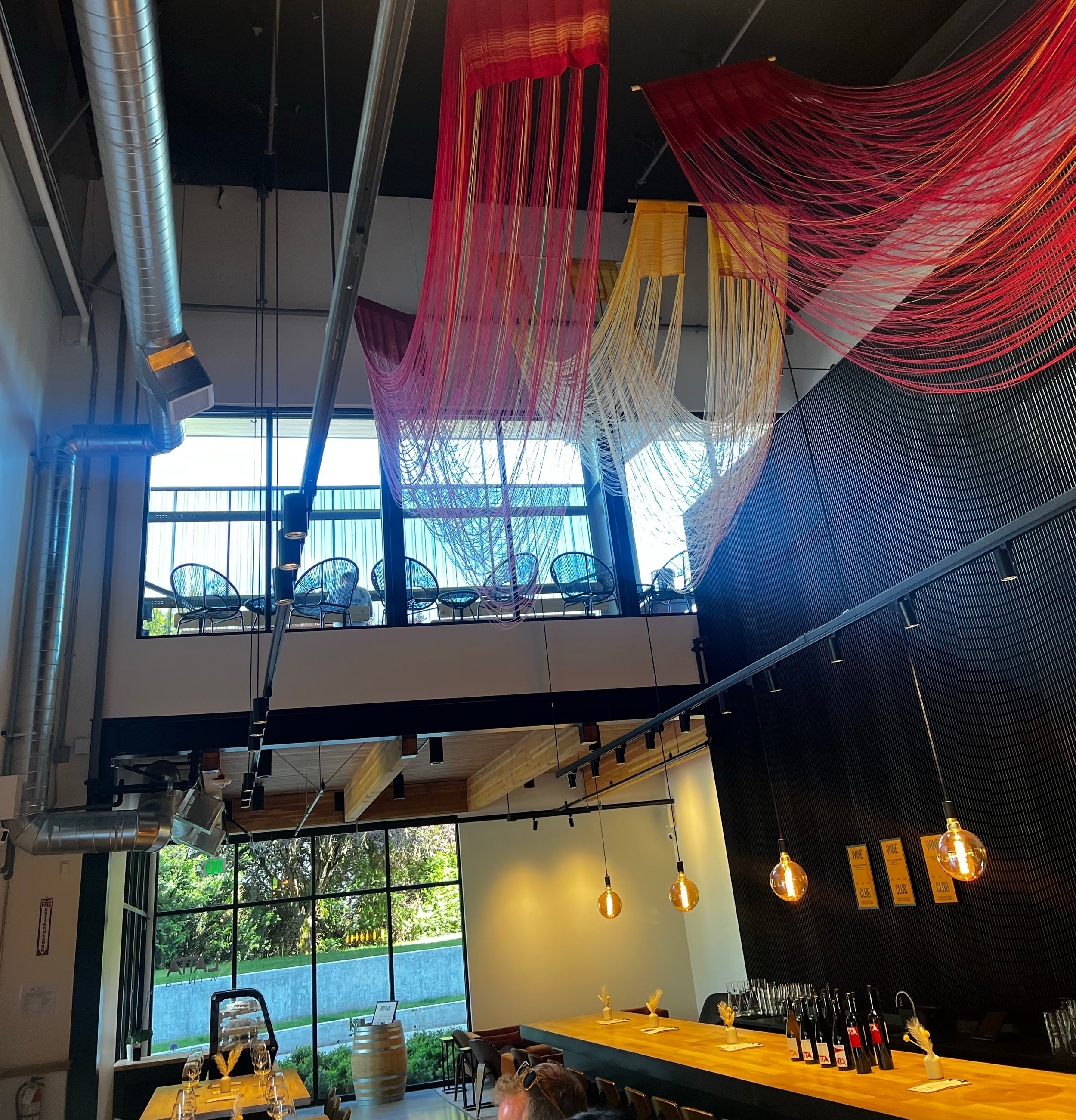 the interior of Latta Wines' lofty, artistic tasting room