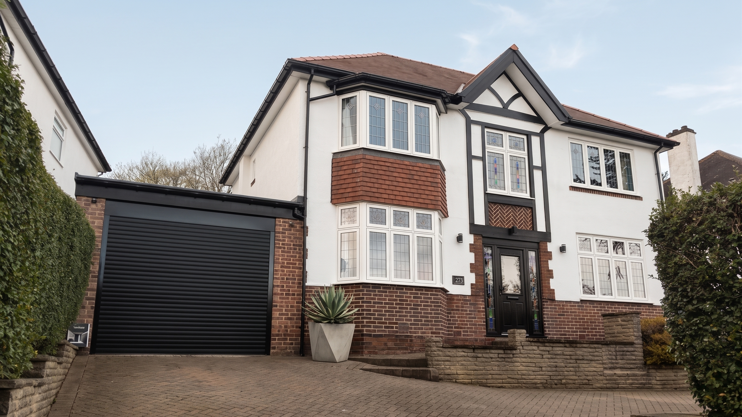 Renovated and modernized front elevation of the 1930s semi-detached house in S11 Sheffield, featuring updated flush sash windows.