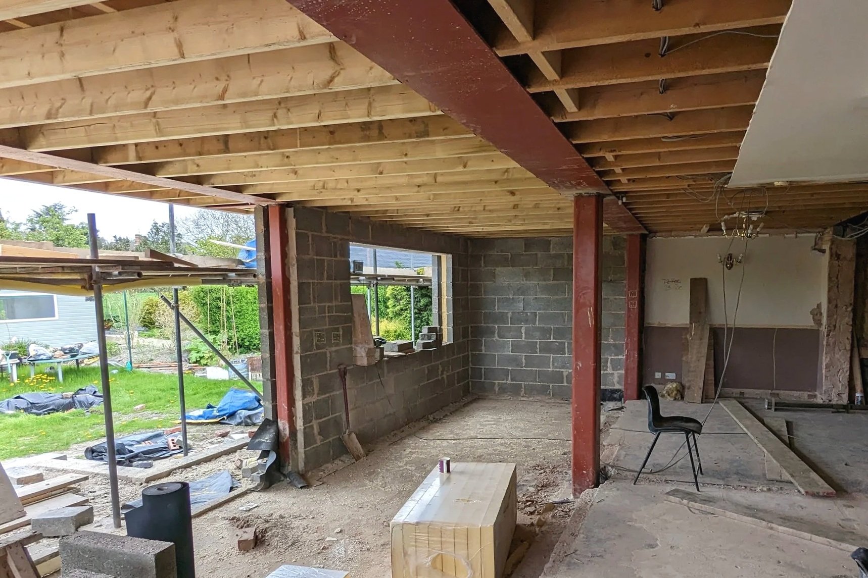 EXTENSION BUILD IN PROGRESS WITH EXPOSED STEELWORK AND TIMBER