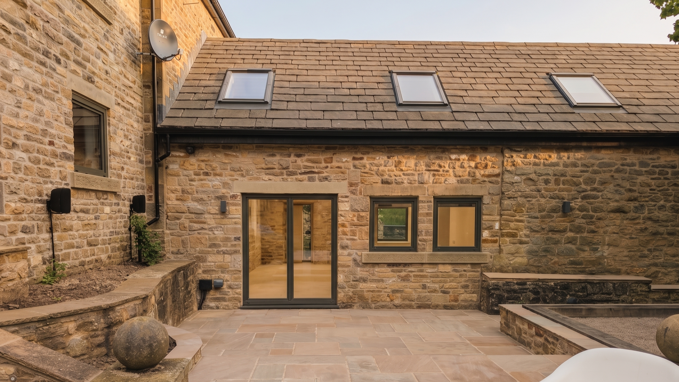 Renovated gritstone farmhouse near Dore, Sheffield following a deep retrofit and barn conversion by MAD Architects LLP