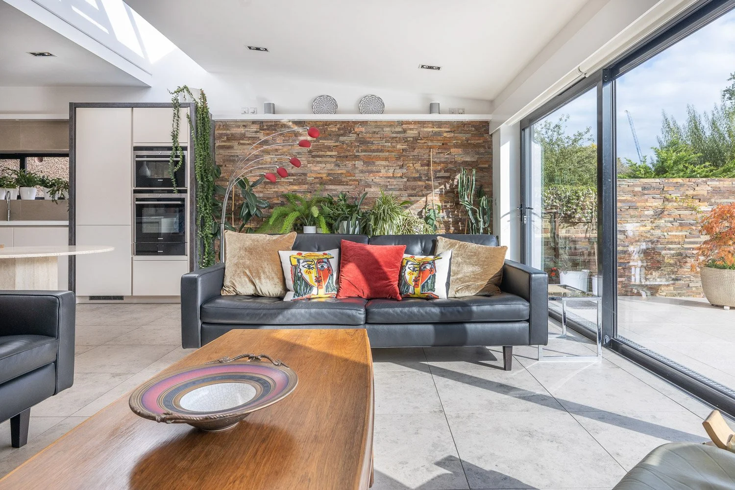 Contemporary living room next to open plan garden design