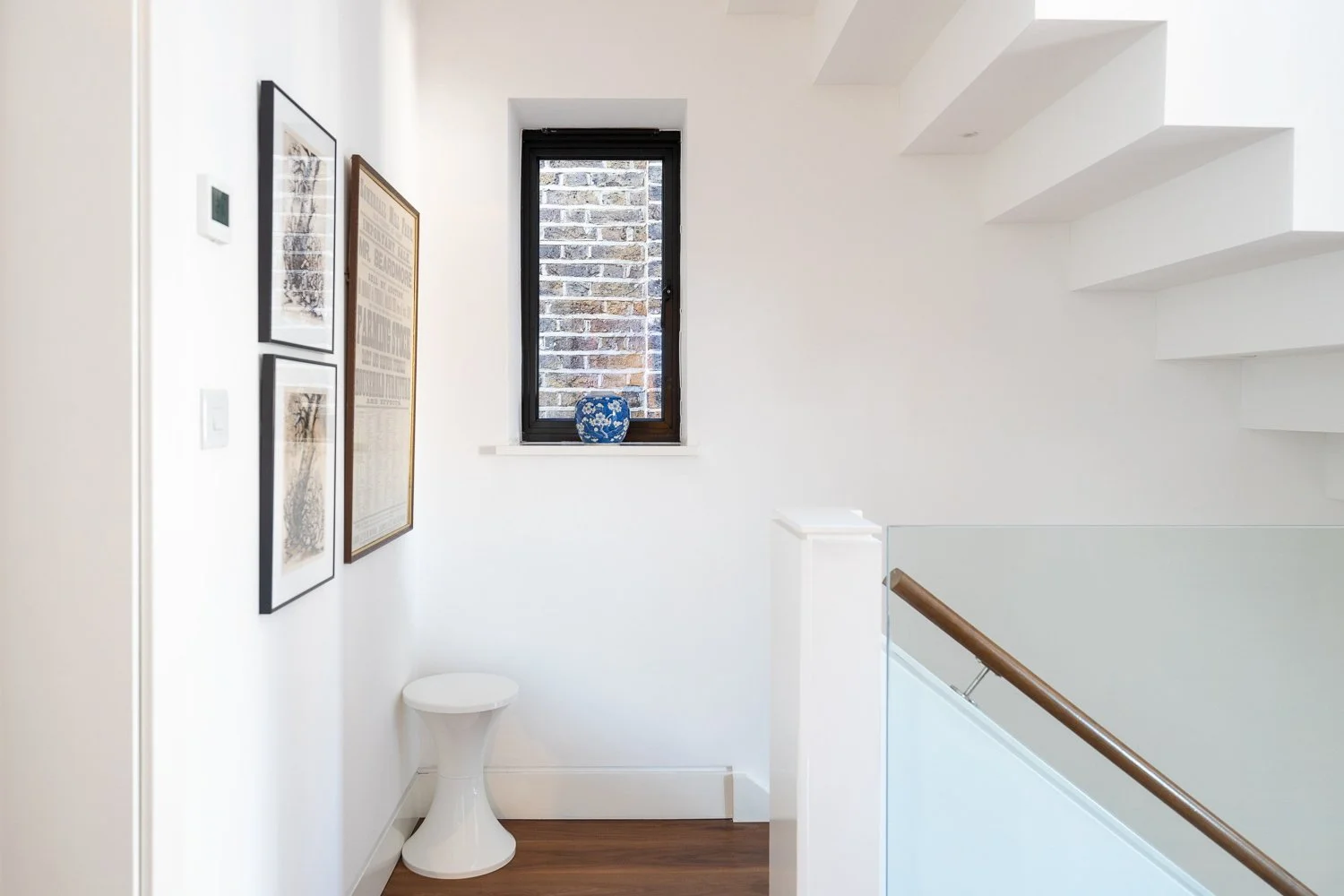 stair case and window design with stunning white walls