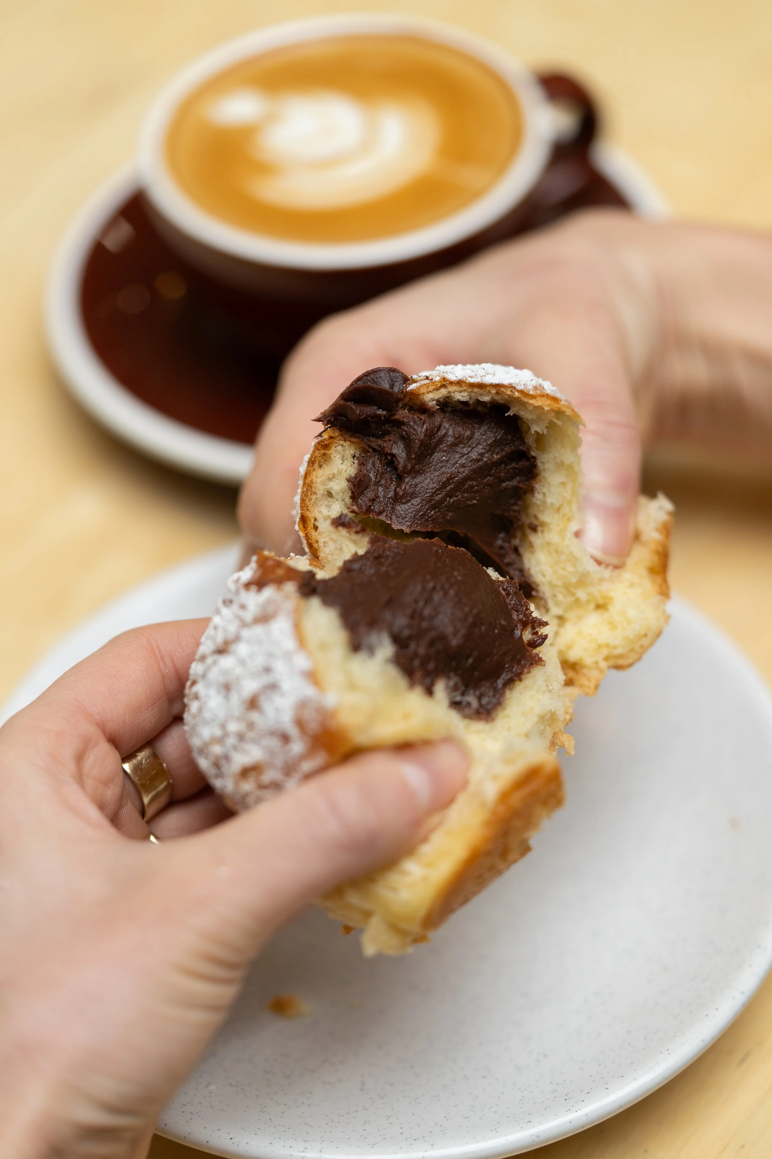 A open Chocolate Hazelnut Bun full on ganache at Butterken Bakery