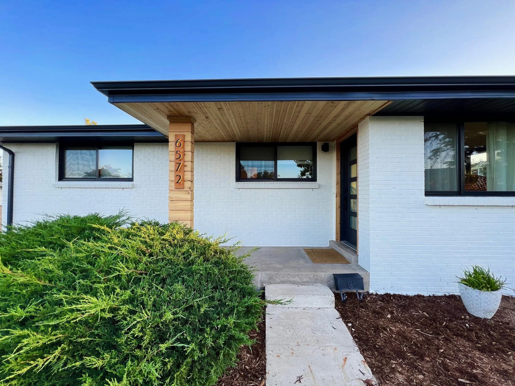 Exterior painted home in Denver Colorado with painted brick and painted siding by New Perspective Painting