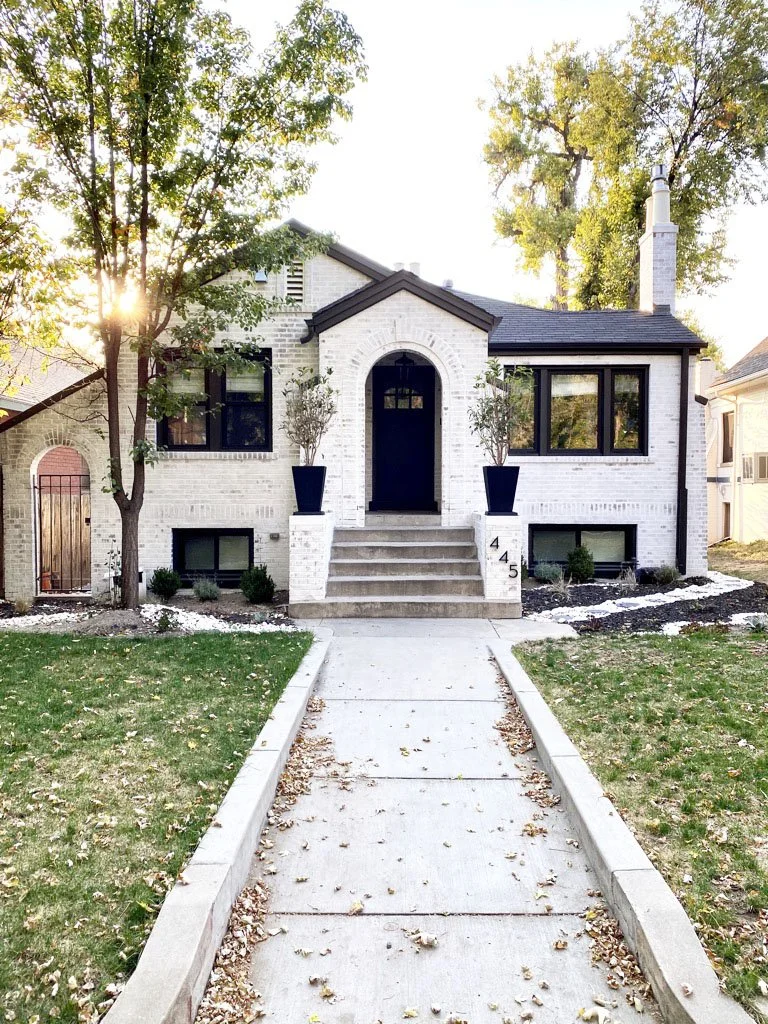 Limewashed brick painted home in Denver Colorado with authentic limewash for brick and painted trim by New Perspective Painting