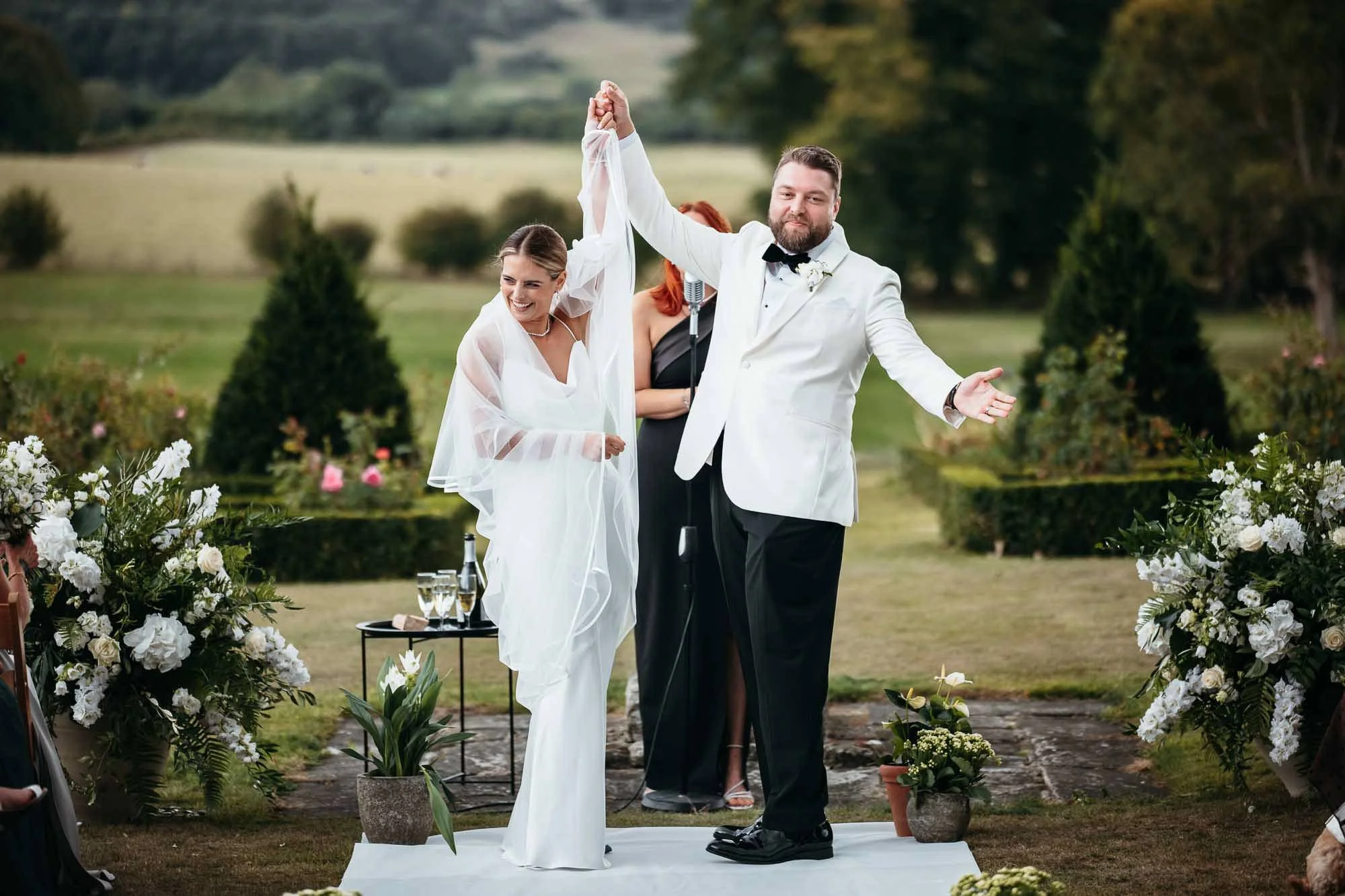 Newlyweds laughing outside Solberge Hall in North Yorkshire
