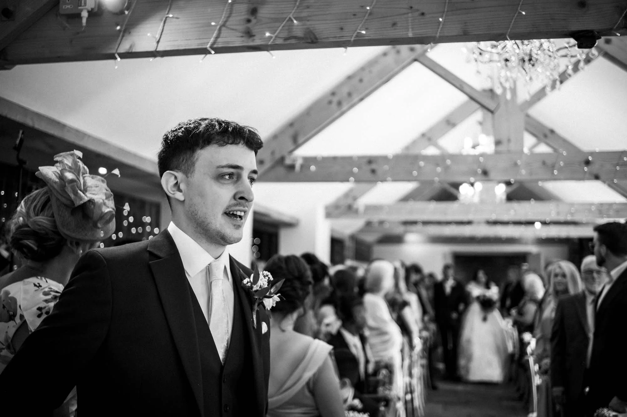 Dan watching Aimee walk down the aisle in the barn