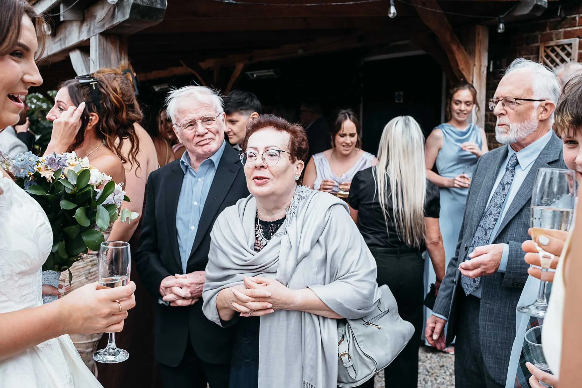 Guests gathered with drinks in the courtyard at Howard Court