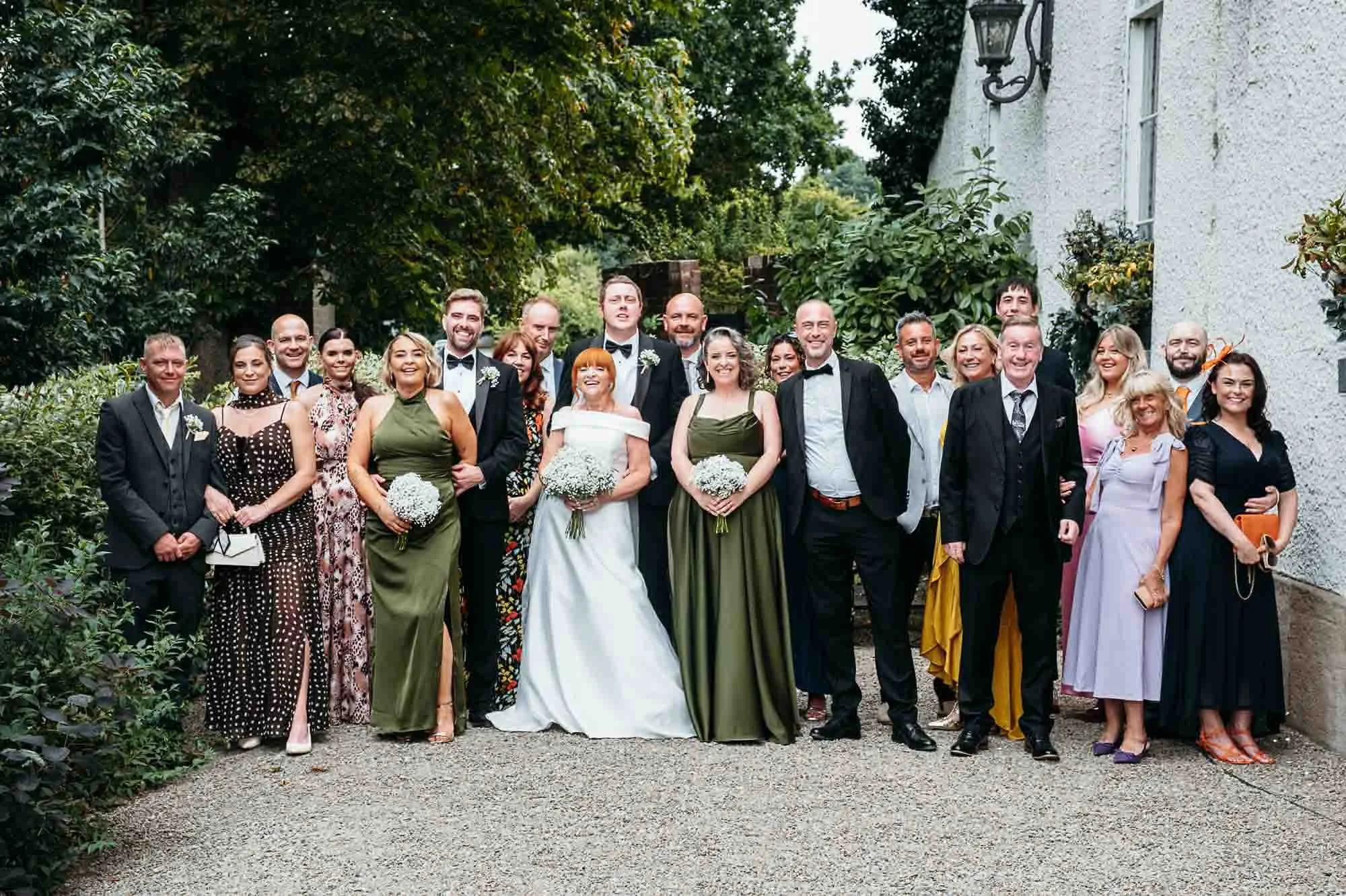 All the wedding guests gathered for a group photograph on the forecourt at The Croft Hotel