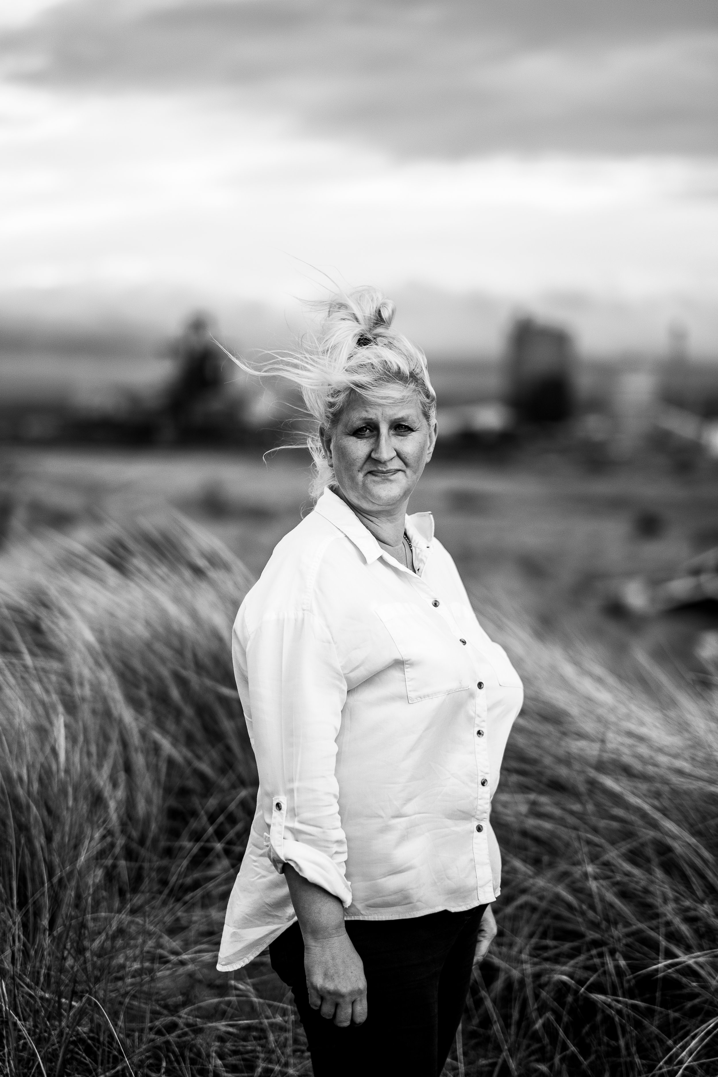 black and white photo of a women looking into the camera
