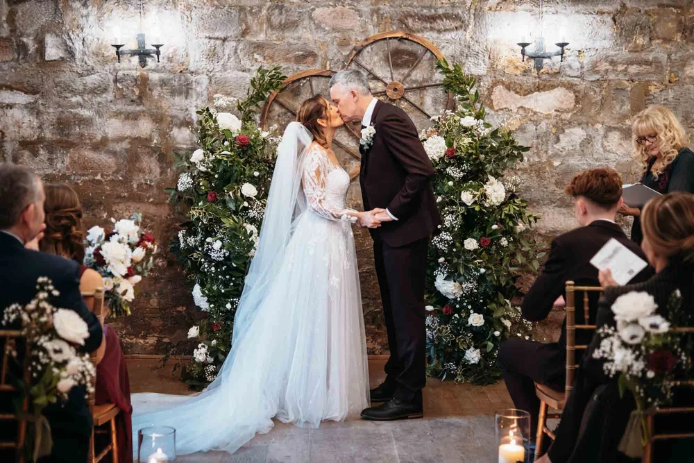 Winter wedding ceremony inside the Courtroom at Danby Castle
