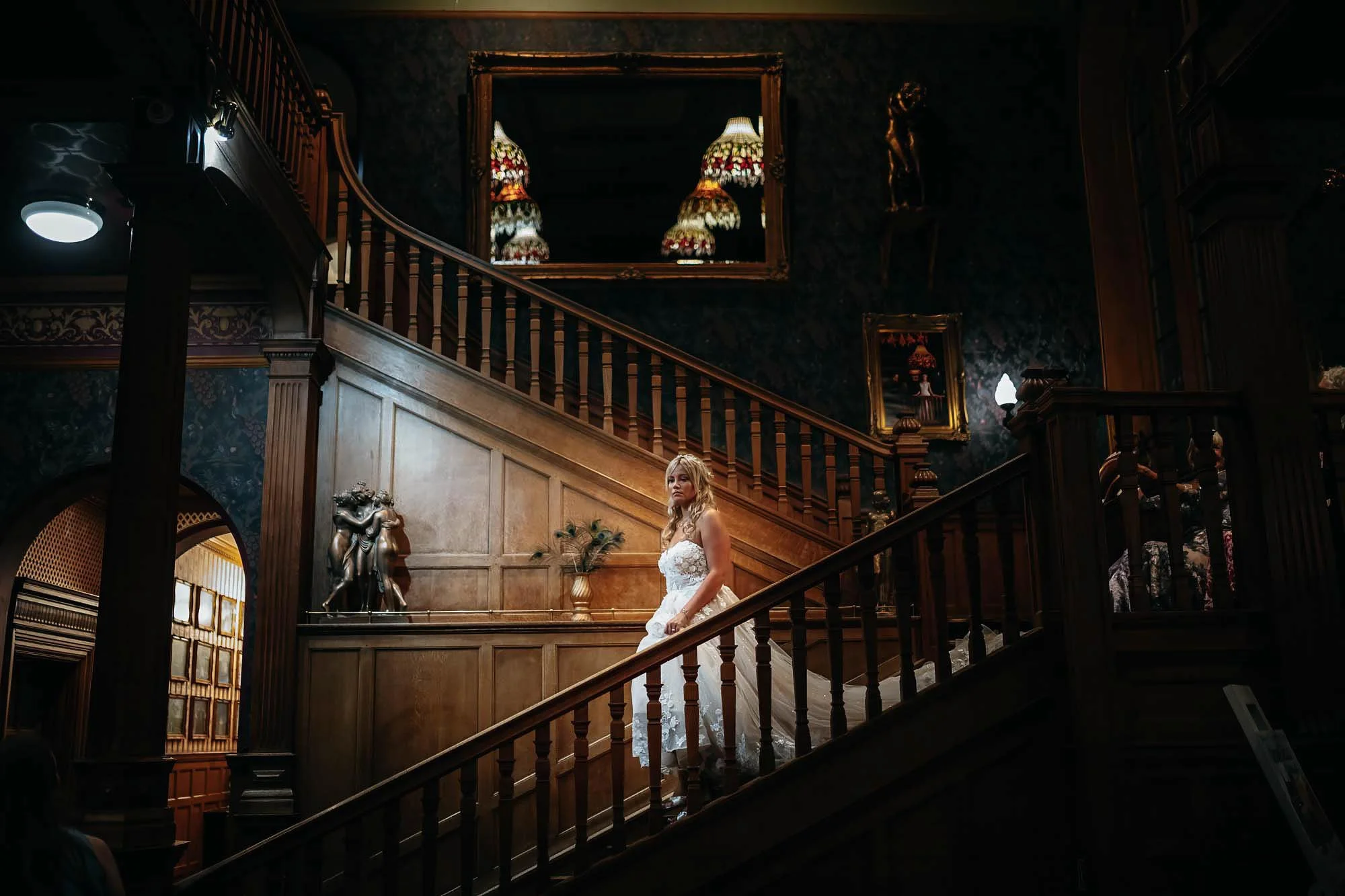 bride walking down the stairs at rushpool hall