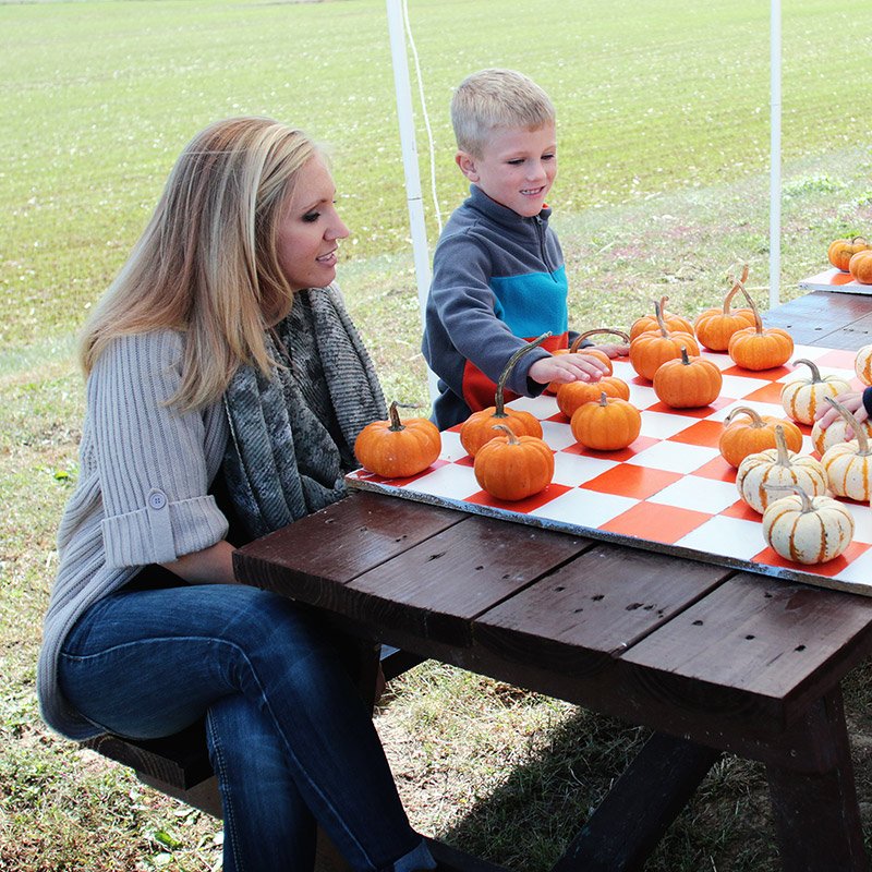 Family Enjoying Pumpkin Painting