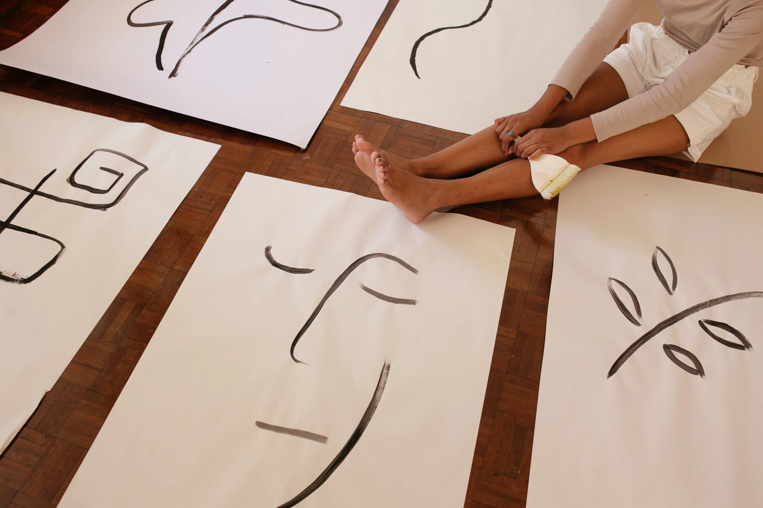 crop-woman-and-abstract-illustrations-on-floor-3817676.jpg
