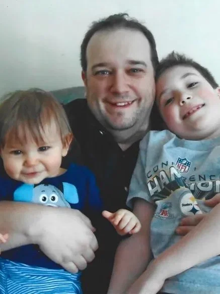 An image of Jason Williams and his sons