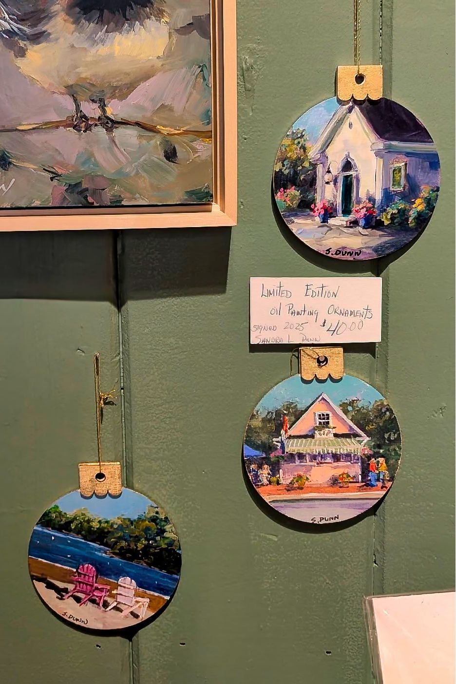 The ornaments we carry are made by a few of our talented, local artists from Michel Paul Artist Studio and Gallery. These ornaments are by  Sandra L. Dunn and have been selling briskly. ($40/each)