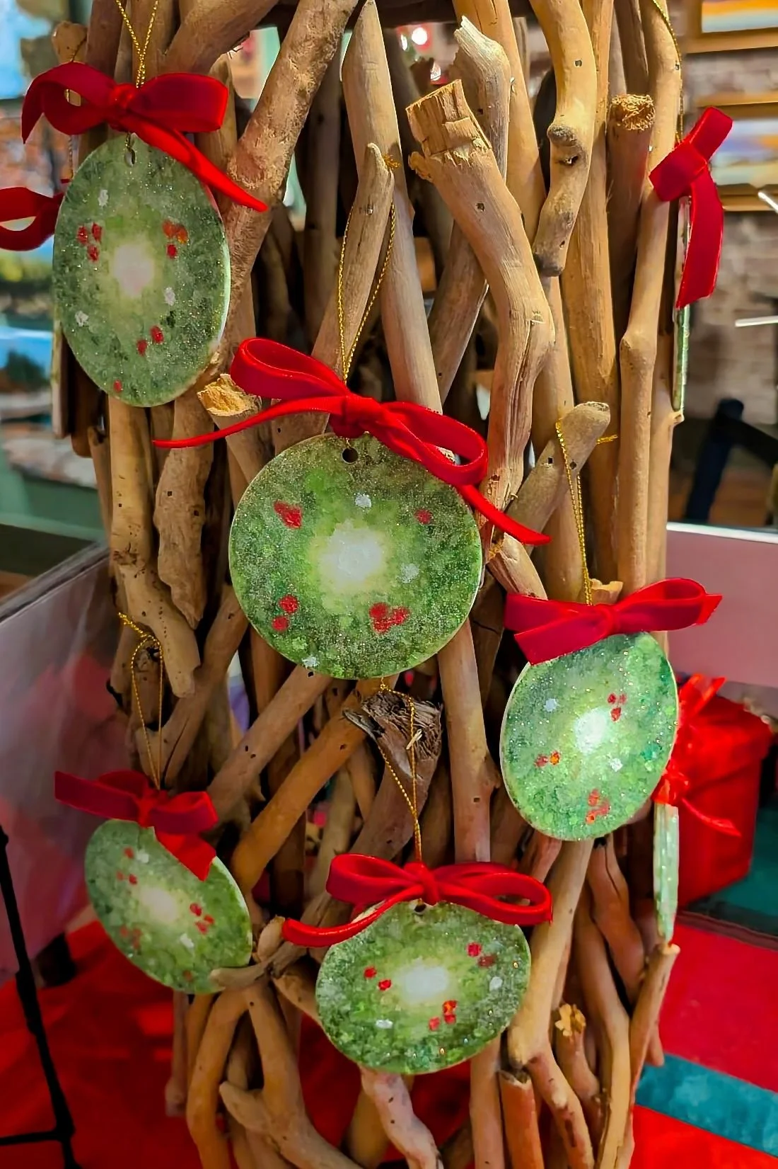 Michel-Paul's ornaments for this year are wreaths painted on Ceramic, signed and dated. $30