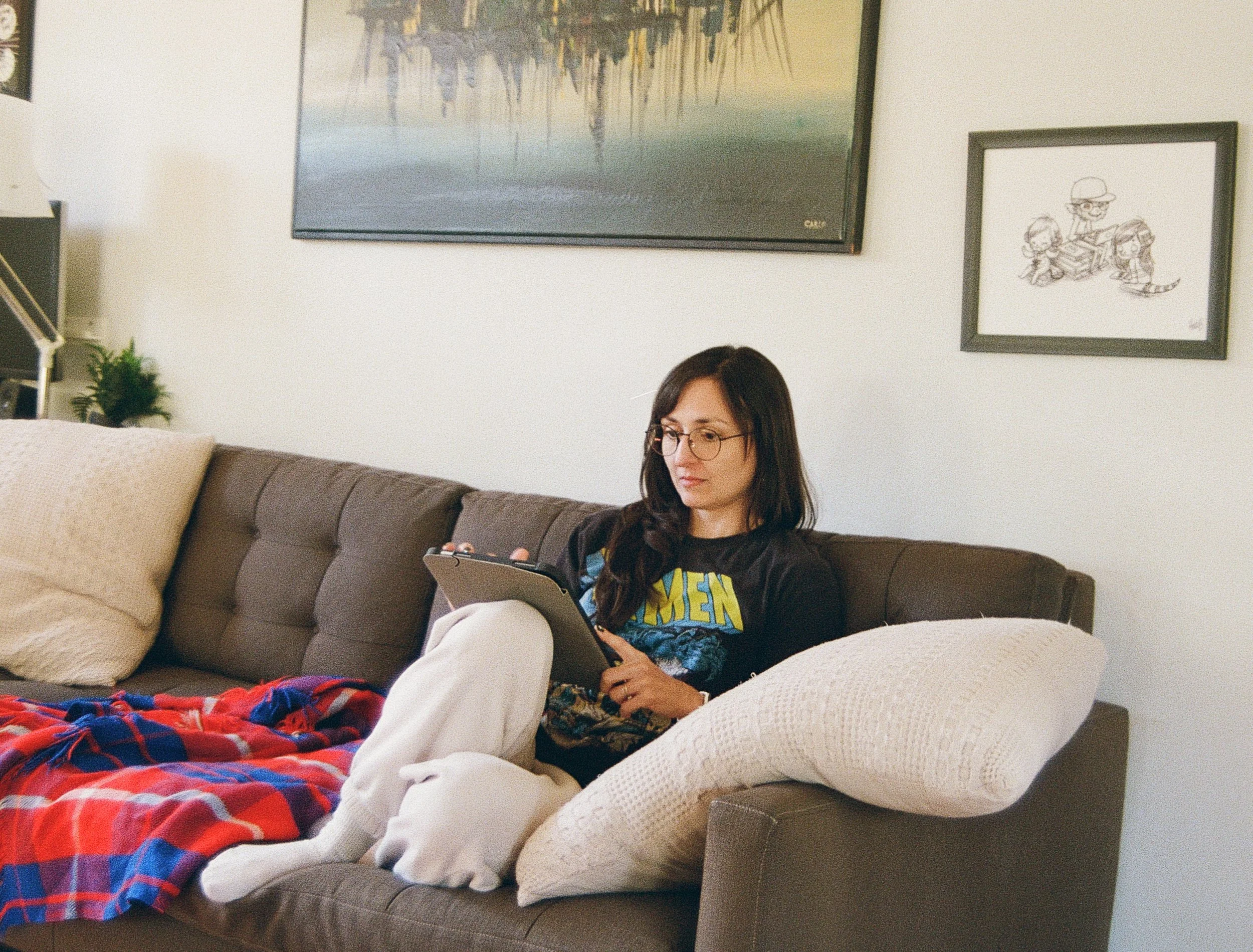 Kristen in Her X-Men Shirt on her iPad.jpg